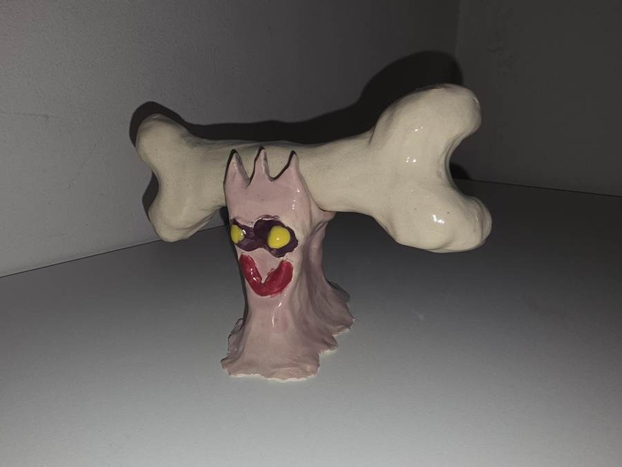 Ceramic bone resting on its porcelain bone holder